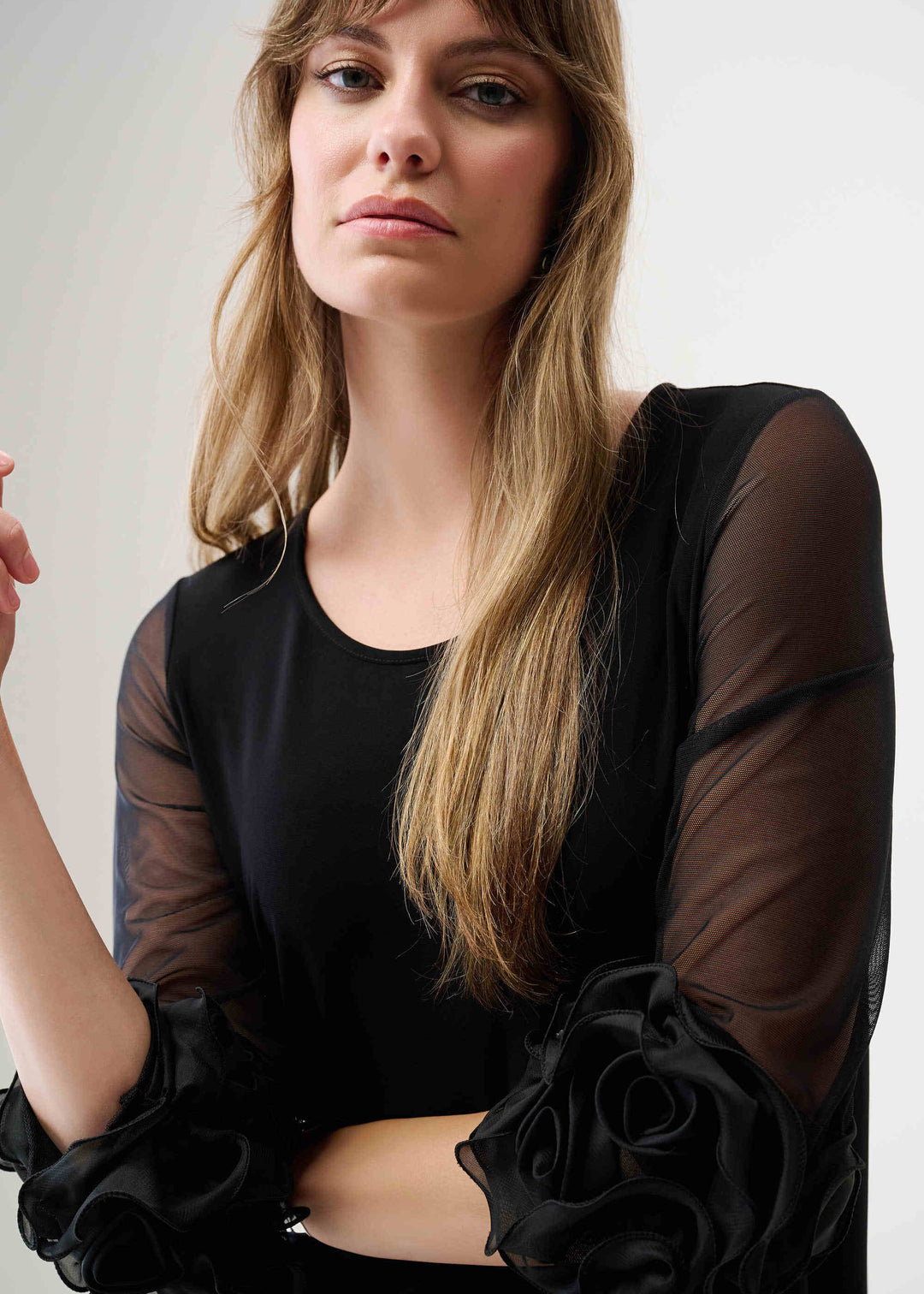 close up of plus size Joseph Ribkoff Jersey Mesh Swing Dress with Ruffle Trim in Black