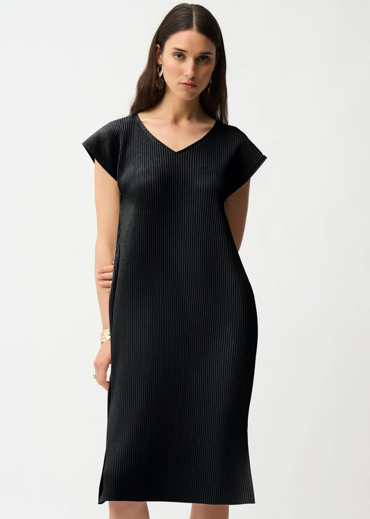 Woman wearing a black dress on a white background