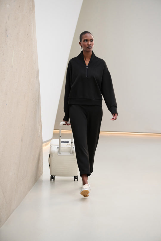 Black jogger pants with ankle-length tapered leg and elastic waistband