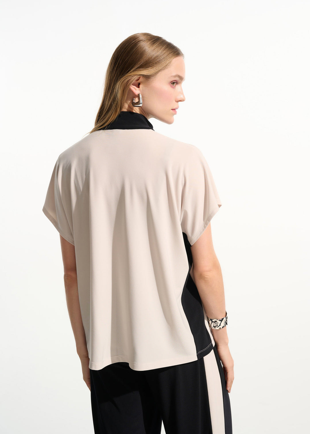 back view of plus size Joseph Ribkoff silky Knit Colour Block S/S Top with Zip Neck in Moonstone Black