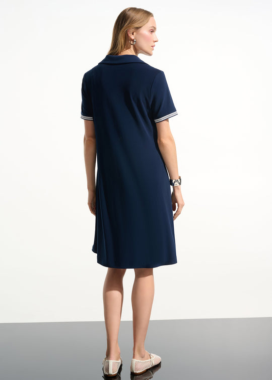 back view of plus size Joseph Ribkoff Silky Knit Trapeze Tennis Dress with Polo Collar in Indigo