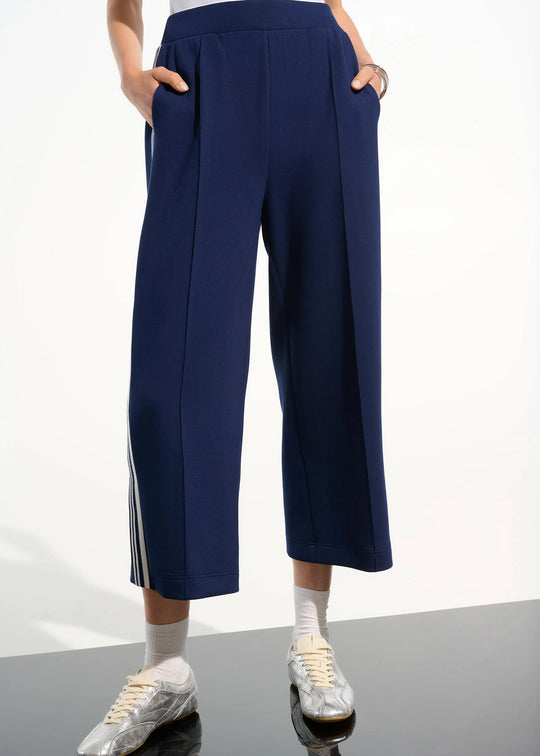 front view of plus size Joseph Ribkoff Scuba Jersey Culotte Pant with Side Stripe in Indigo