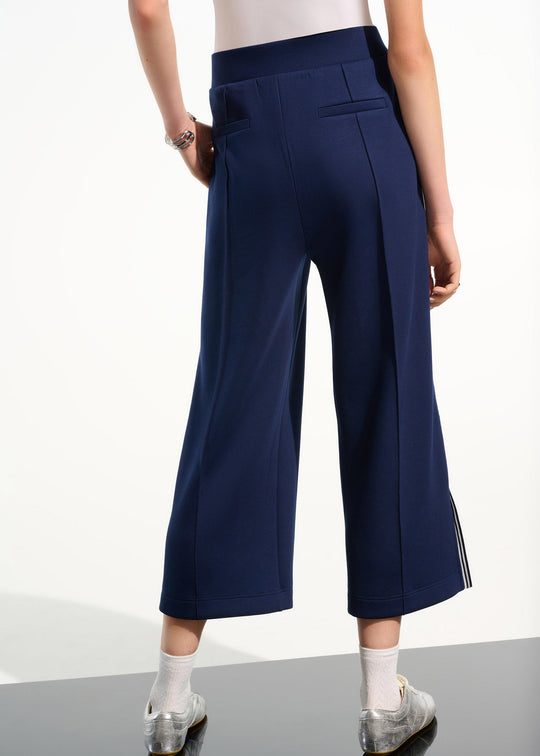 back view of plus size Joseph Ribkoff Scuba Jersey Culotte Pant with Side Stripe in Indigo