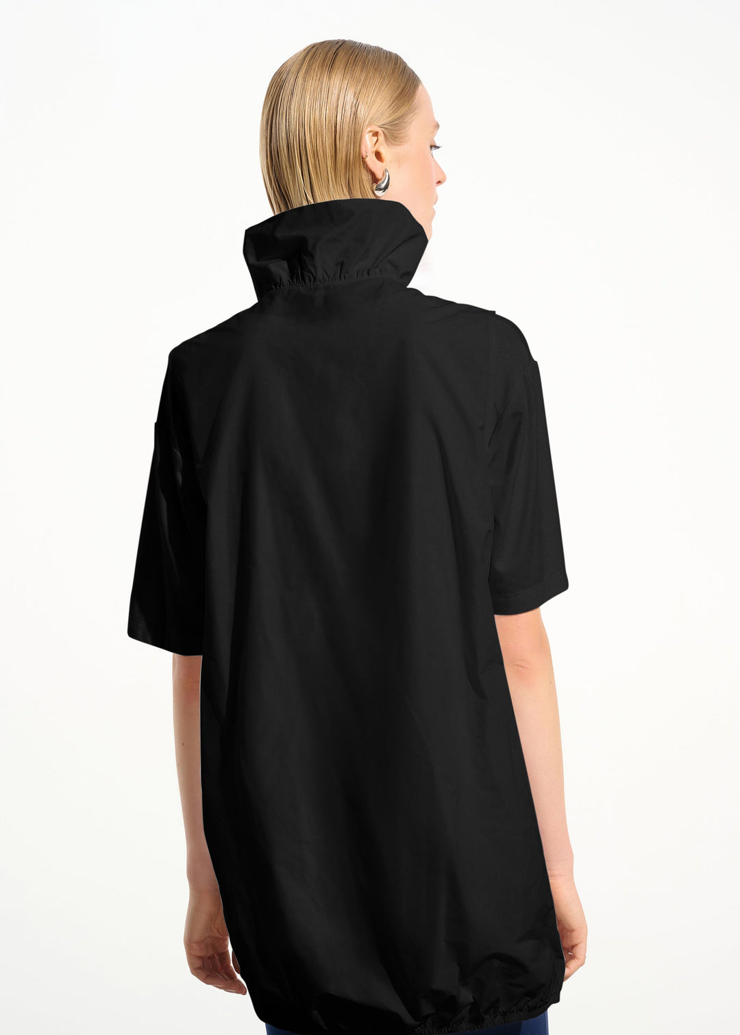 Person wearing a black jacket on a white background