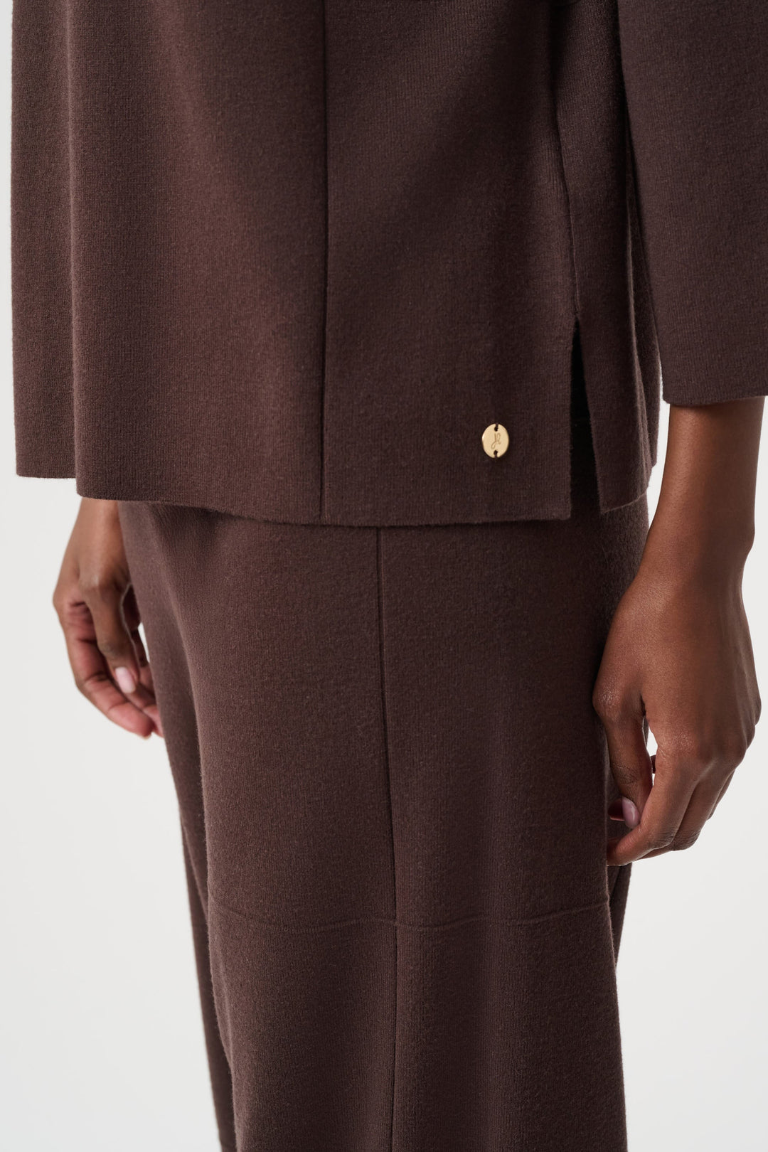 Brushed viscose straight sweater hem with gold button detail, dark mocha-brown.