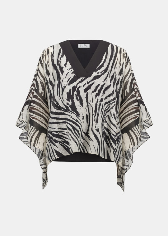 Zebra print poncho on a white background
