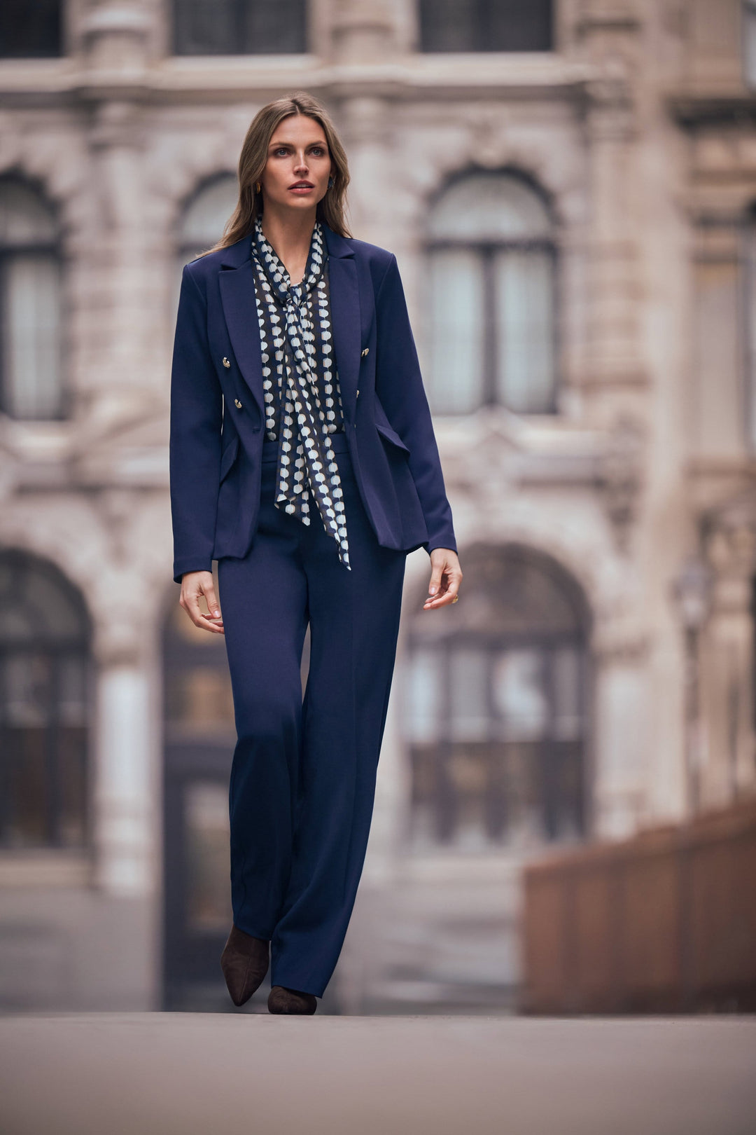 Joseph Ribkoff indigo wide-leg pants, model wearing with patterned top