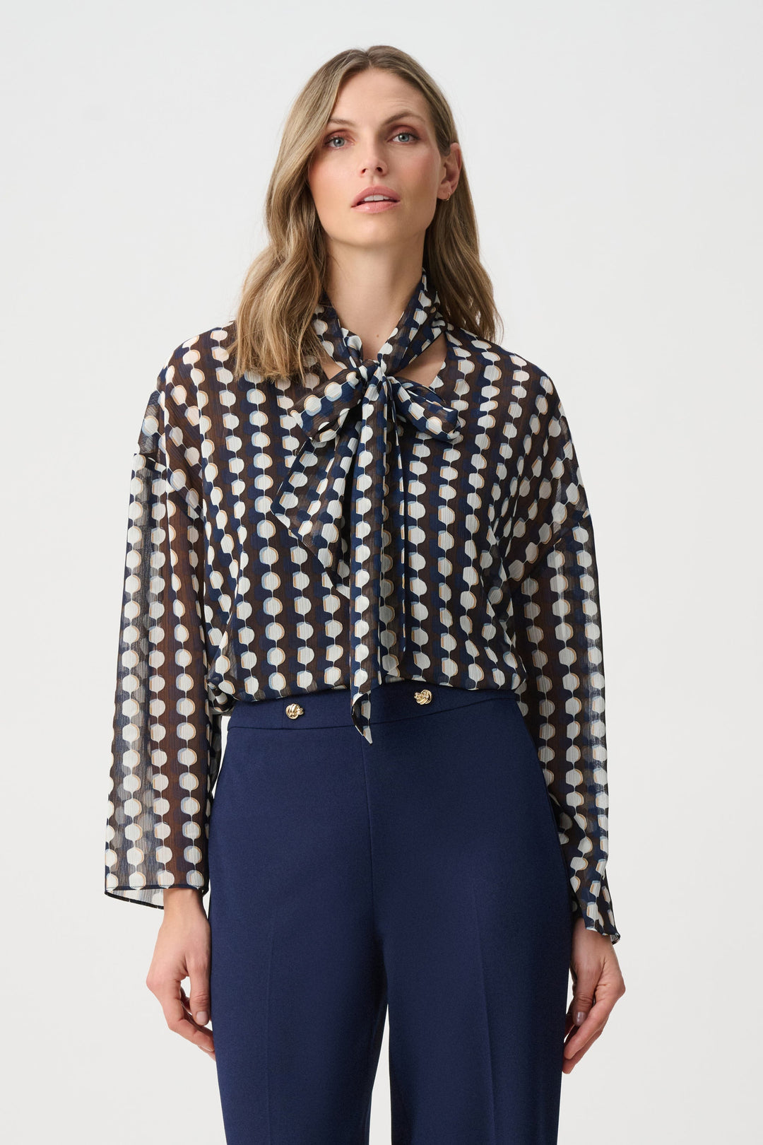 Tie-neck chiffon blouse with brown and navy geometric print, long sleeves