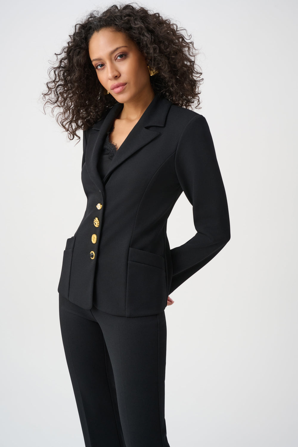 Joseph Ribkoff black scuba crepe fitted blazer with gold statement buttons on model