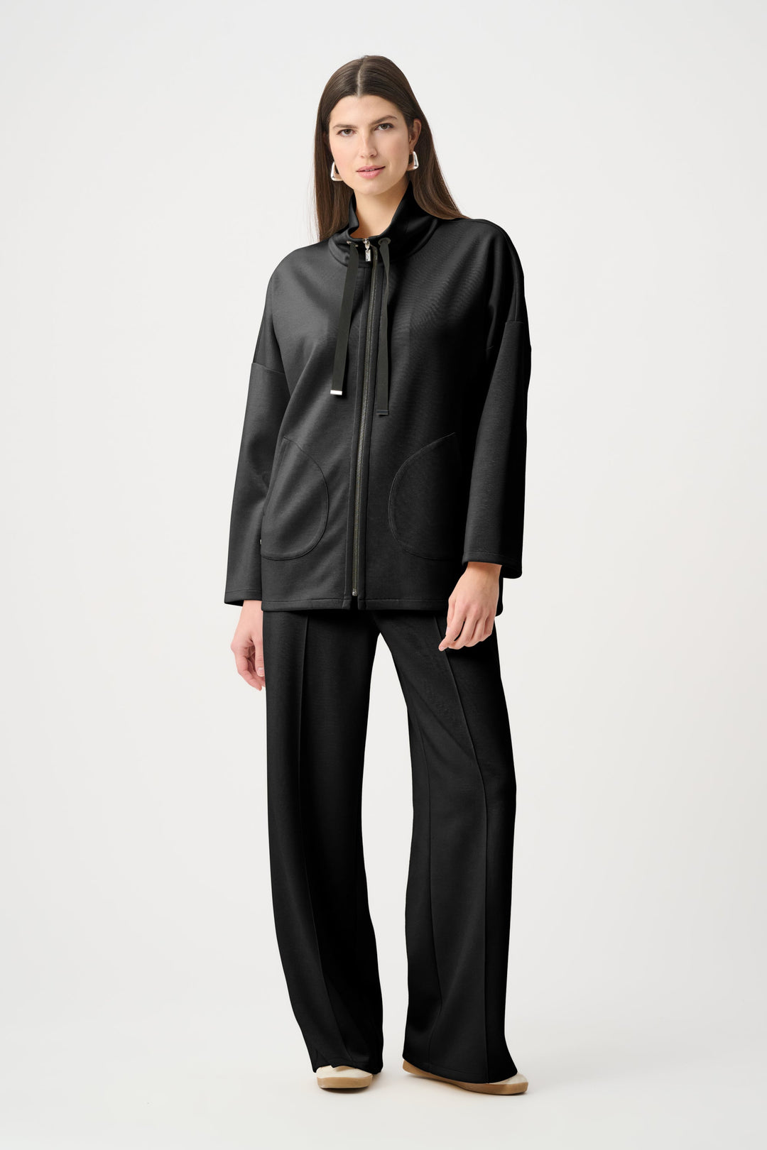Black boxy zip jacket with funnel neck and drawstring, three-quarter sleeves