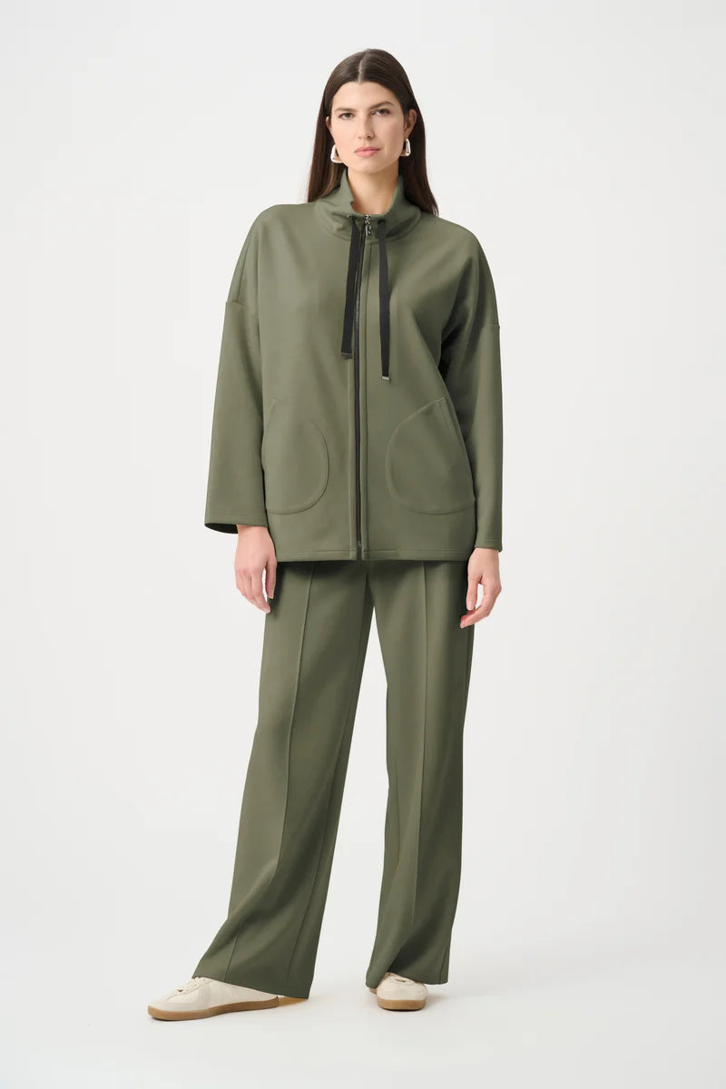 Avocado green boxy funnel-neck zip jacket with two patch pockets and drawstring neck.