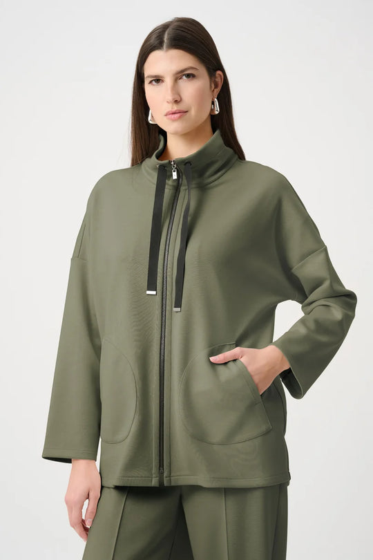 Avocado green funnel-neck zip jacket with black drawstring ties and two patch pockets.