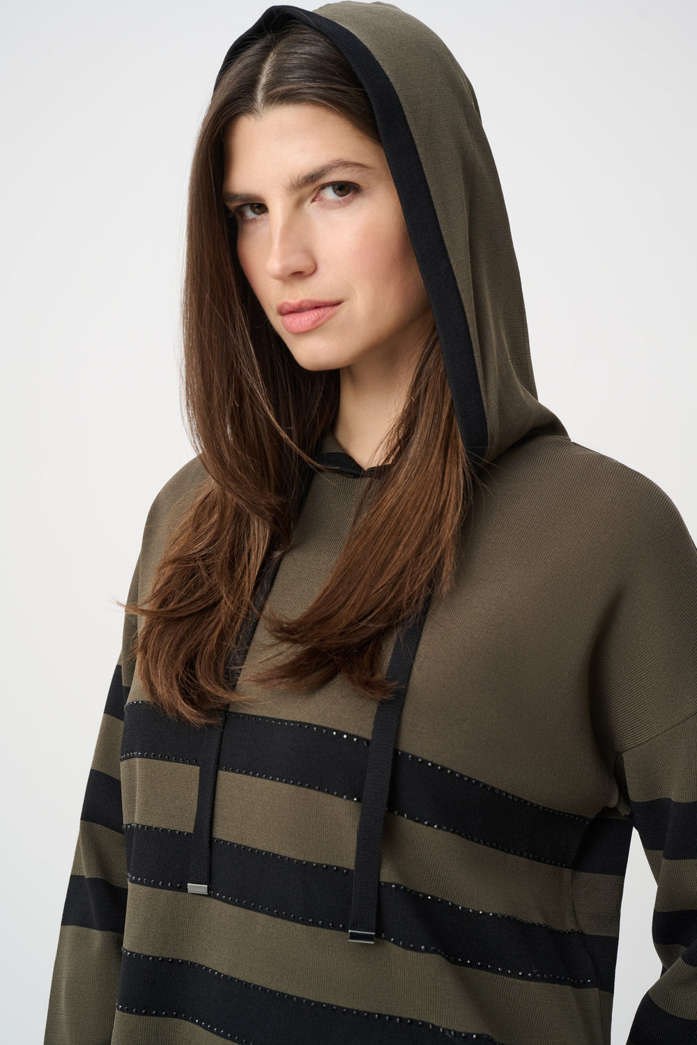 Avocado hooded sweater with drawstring, close-up of dark striped bands and front placket