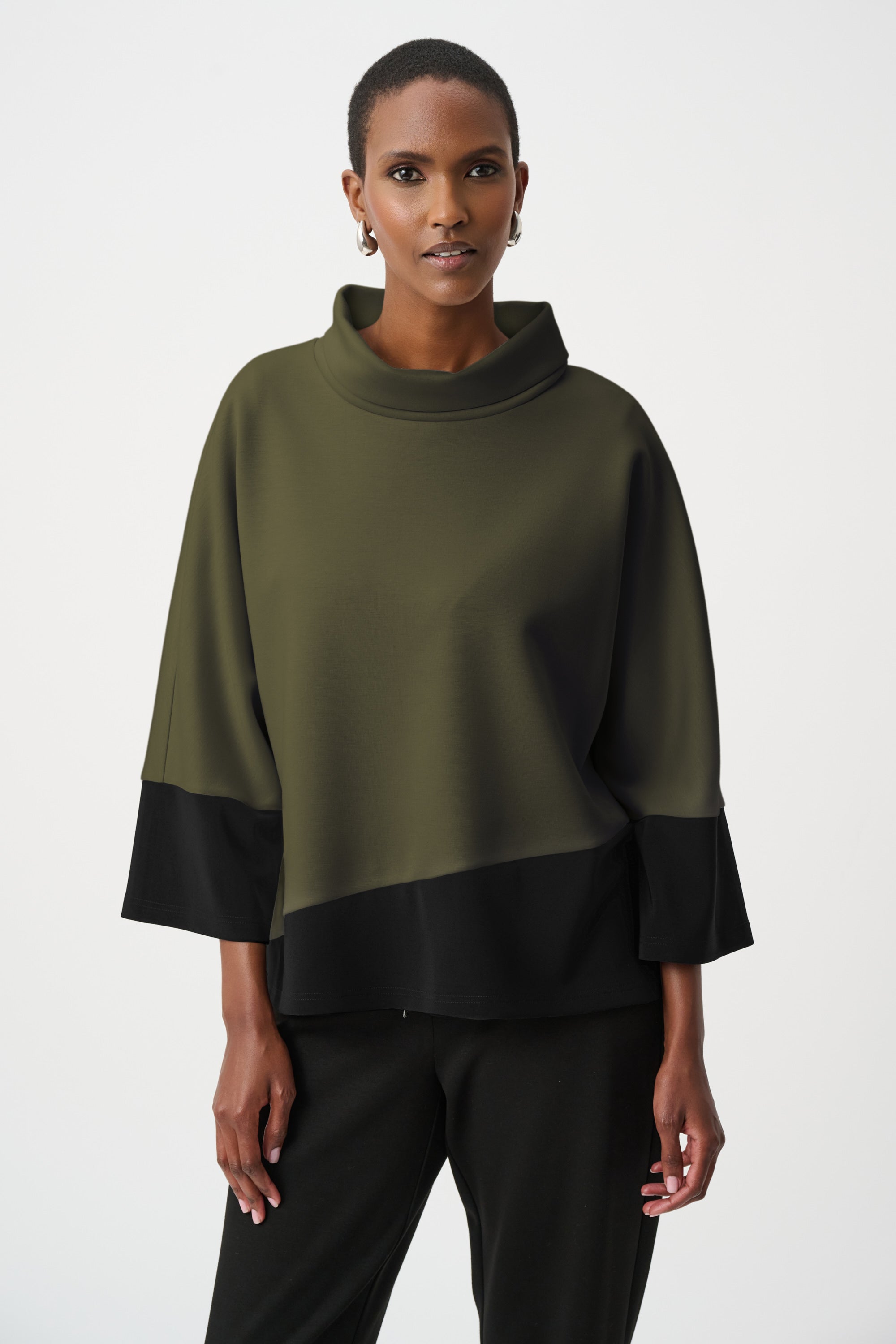 Color block trapeze top with cowl neck in olive green and black worn by model