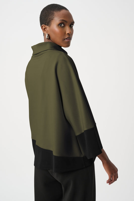 Color block trapeze top with olive green upper section and black lower section, back view