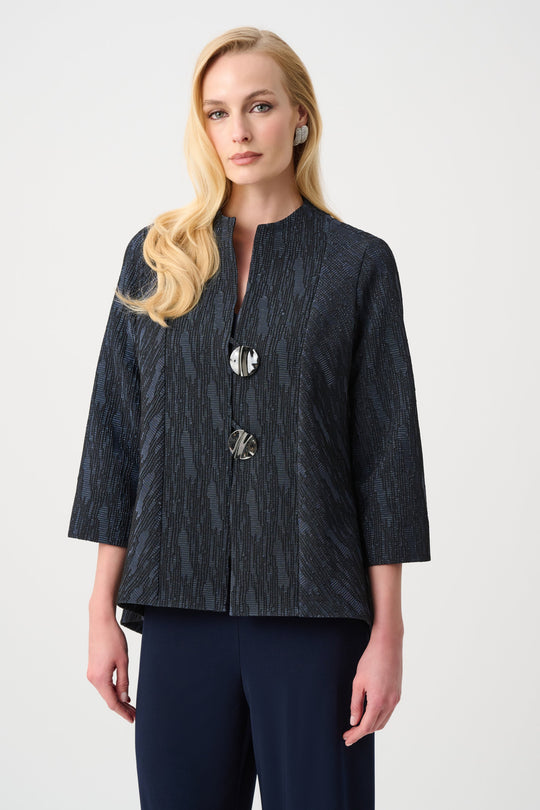 Navy textured jacquard jacket with metallic buttons and three-quarter sleeves on model