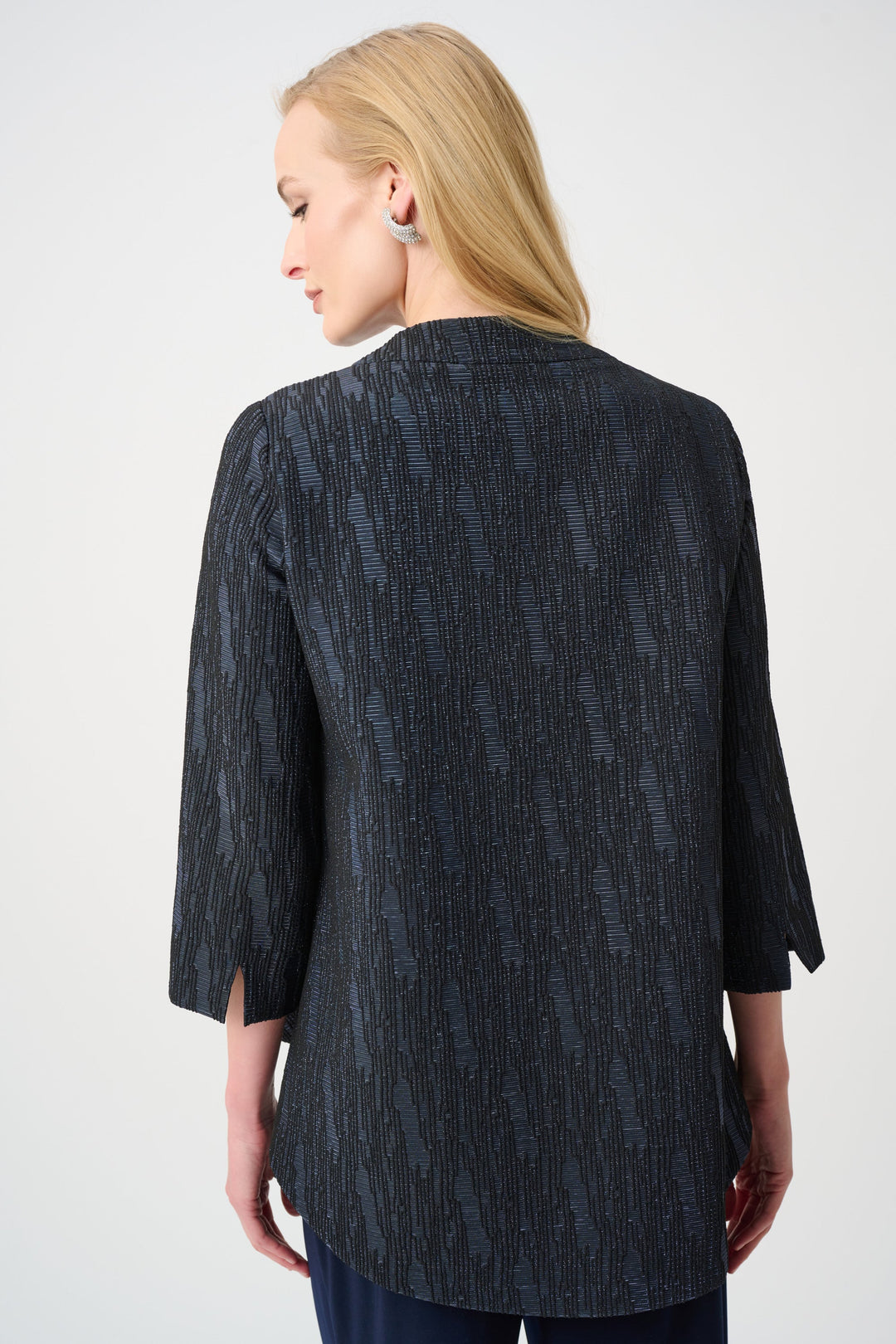 Textured navy jacket with three-quarter sleeves shown from back, trapeze silhouette