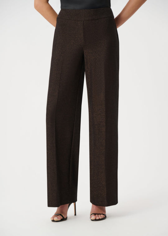 Dark sparkly wide leg pants on model, back view showing straight silhouette