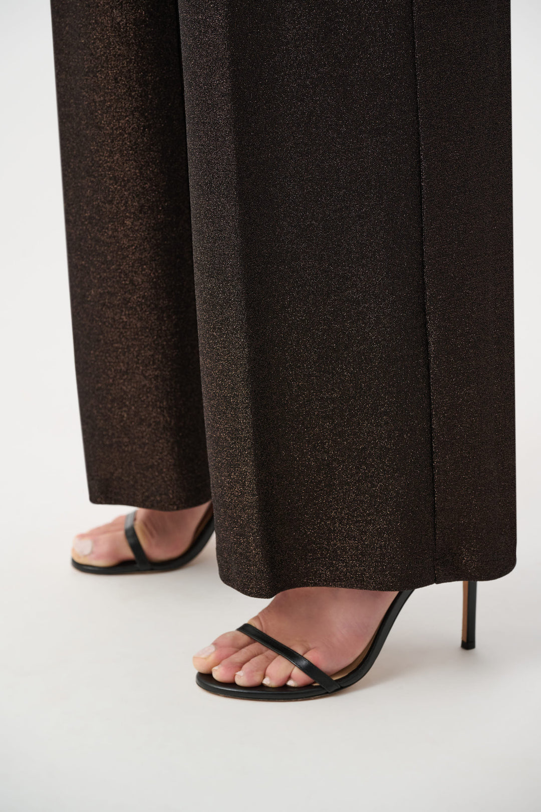 Sparkly wide leg pants in bronze with strappy black high heel sandals