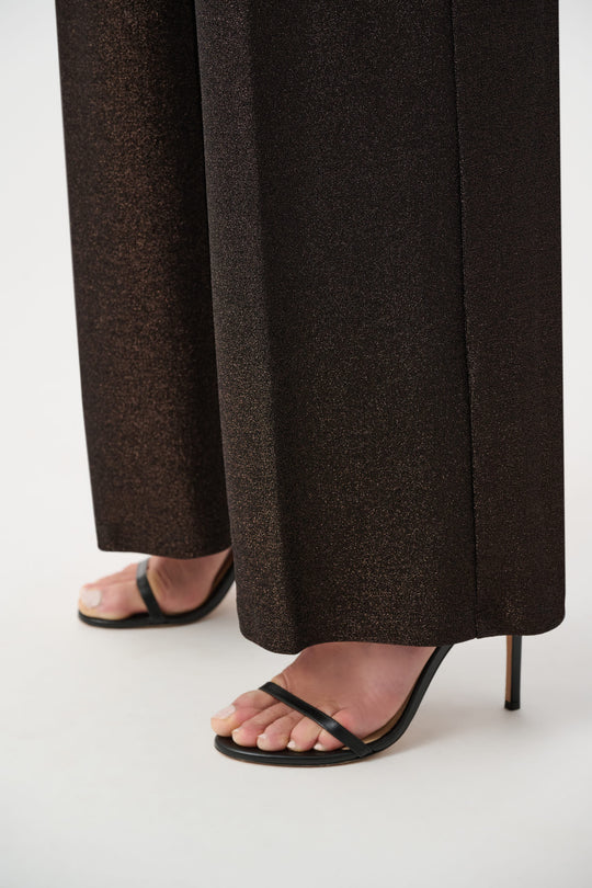 Sparkly wide leg pants in bronze with strappy black high heel sandals