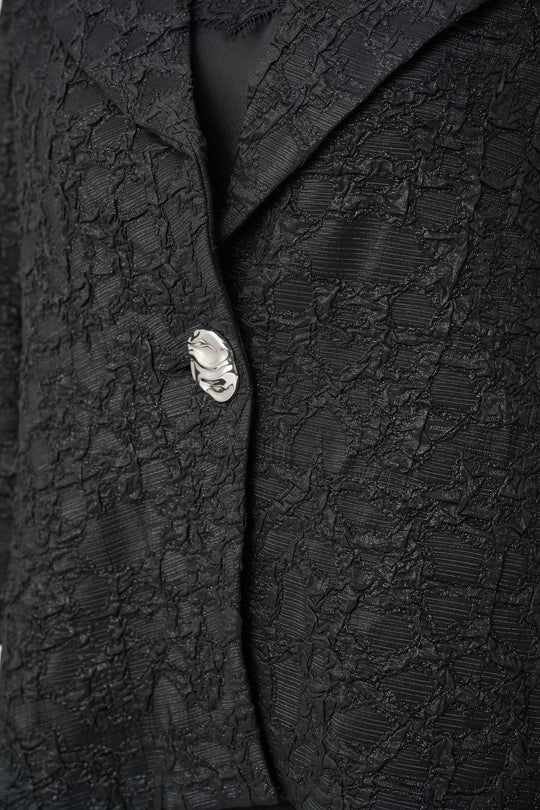 Black textured jacquard jacket with lurex detail and decorative button closure