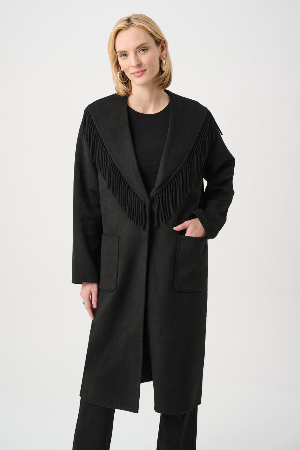 Black wool-blend coat with shawl collar and long fringe trim
