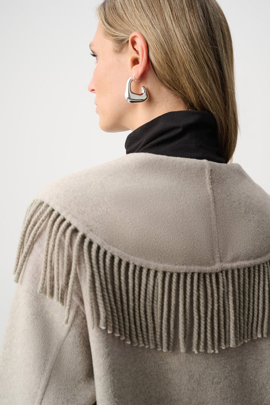 Oatmeal coat back view with shawl collar fringe along the shoulders
