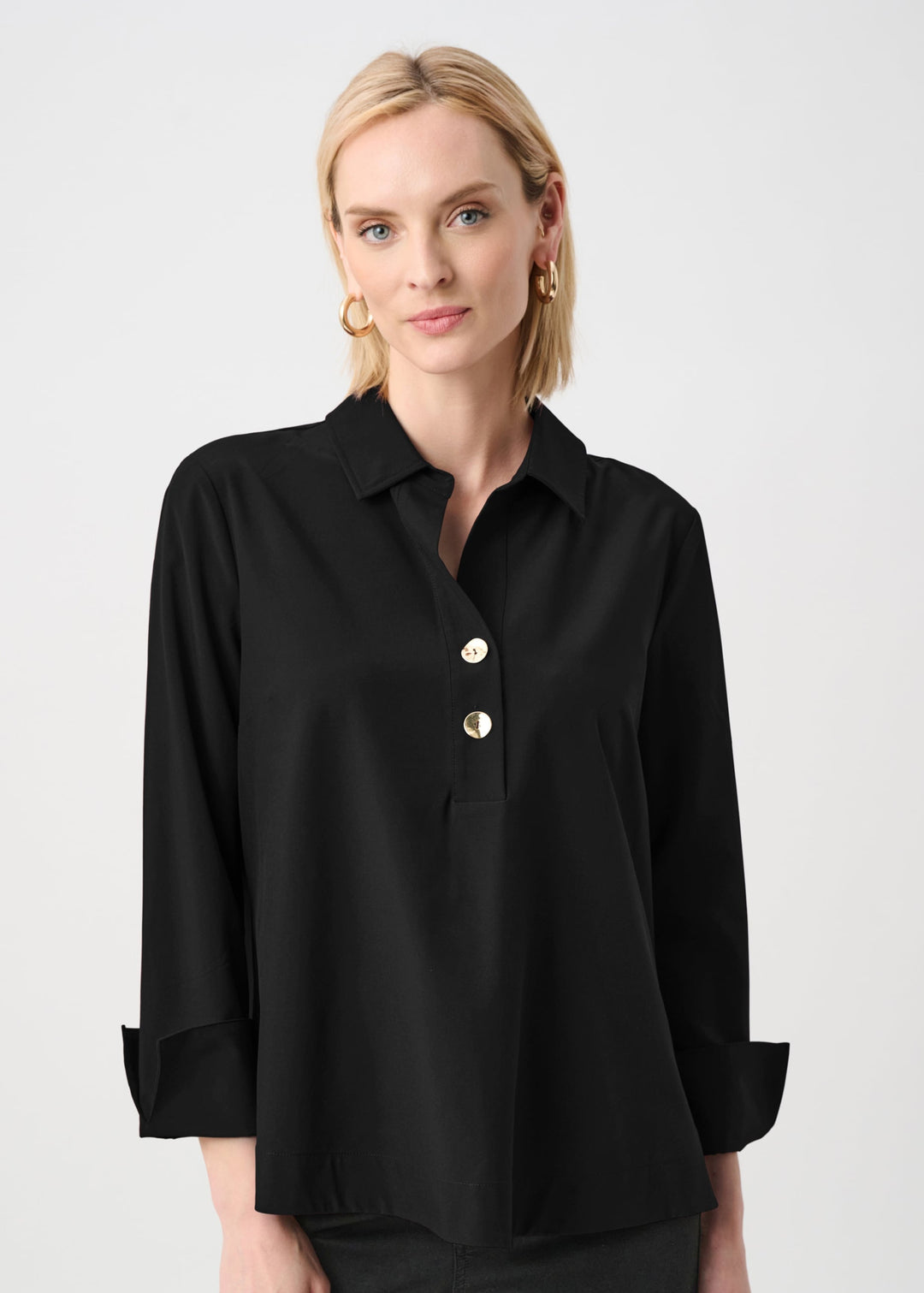Black boxy button-front top with shirt collar and half placket, turnback sleeves