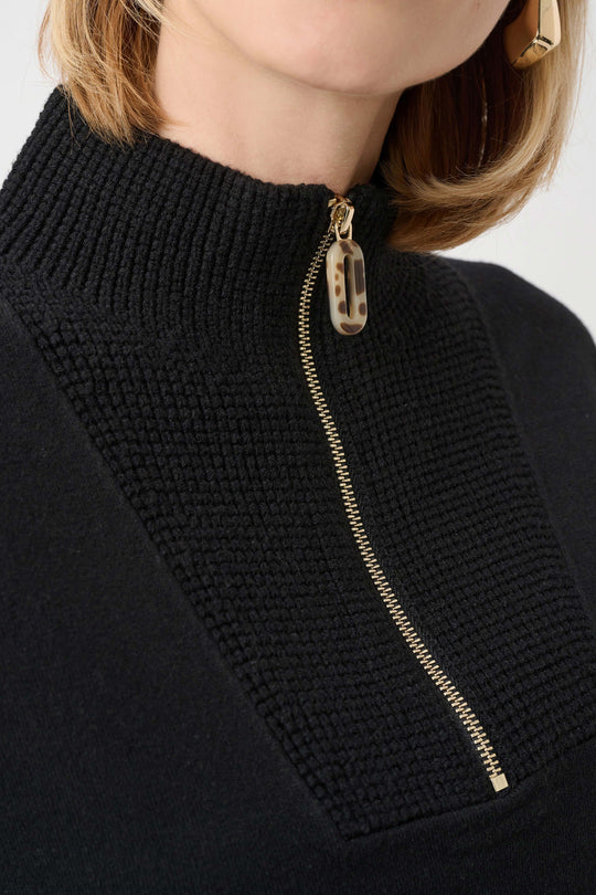 Black brushed sweater with gold-tone zip and high funnel neck