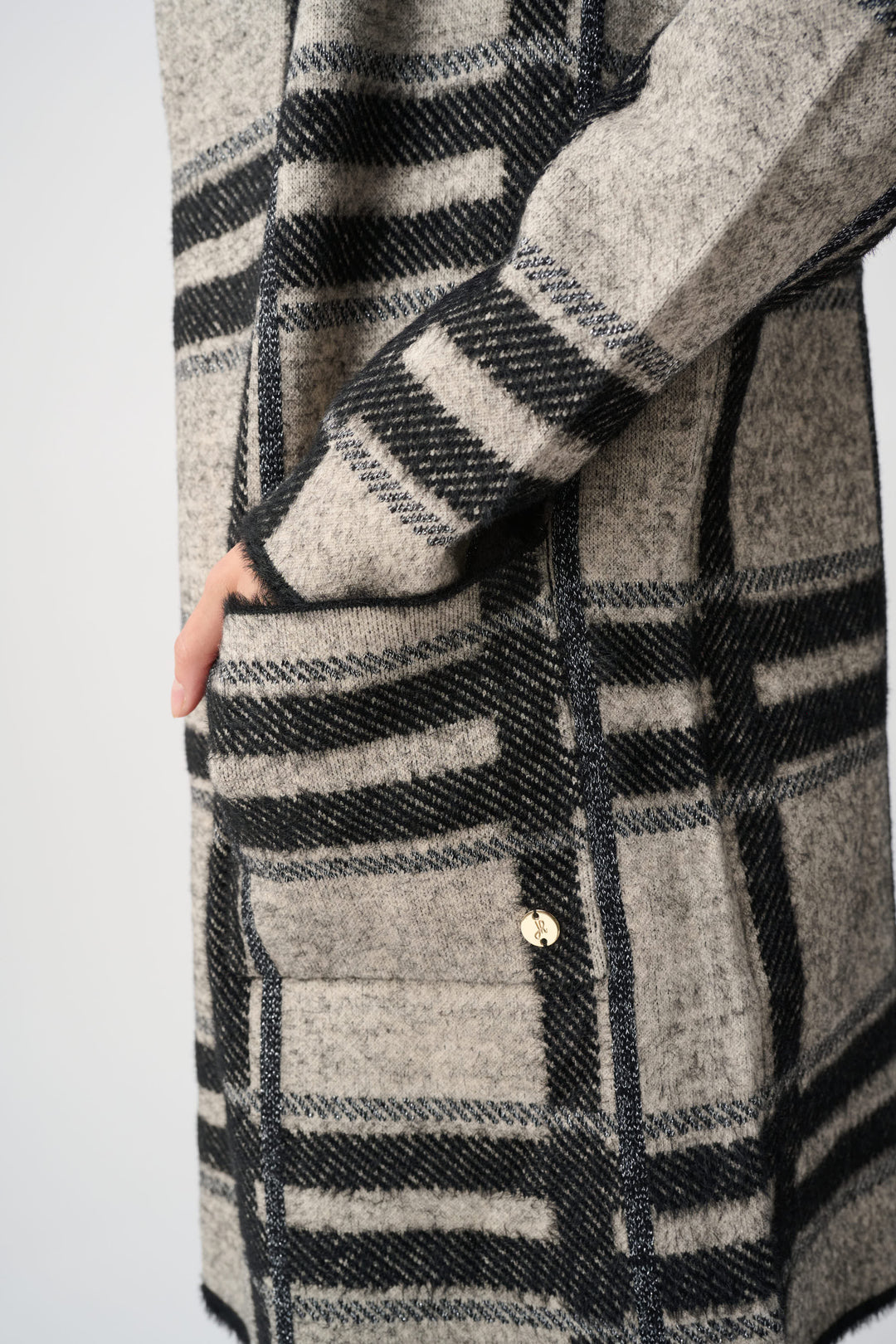 Plaid hooded jacket pocket and front detail, brushed black-and-champagne fabric