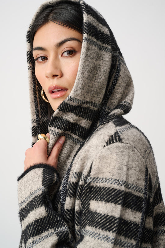 Plaid hooded jacket detail at hood and shoulders, brushed black-and-champagne plaid
