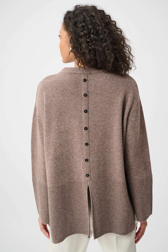 Mink wool crewneck sweater with button-back closure and side slit opening