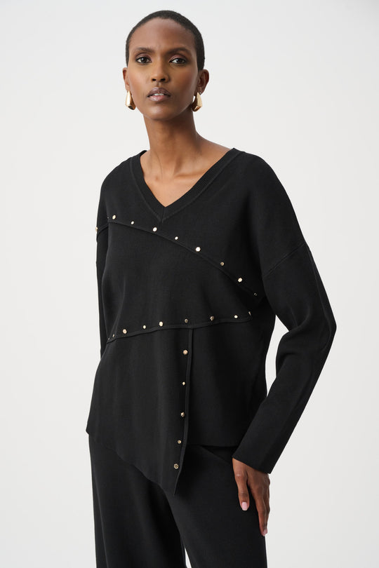 Black asymmetric V-neck sweater with gold metal stud trim and long sleeves