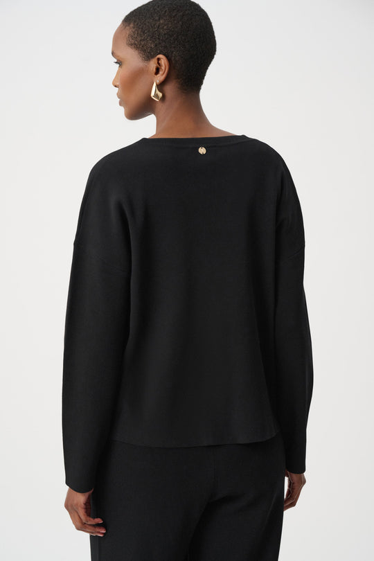 Black asymmetric V-neck sweater back view with gold metal stud details