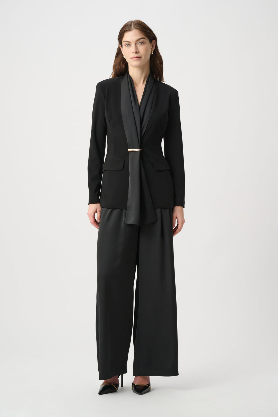 Black scarf-collar blazer jacket with gold bar front closure and long sleeves