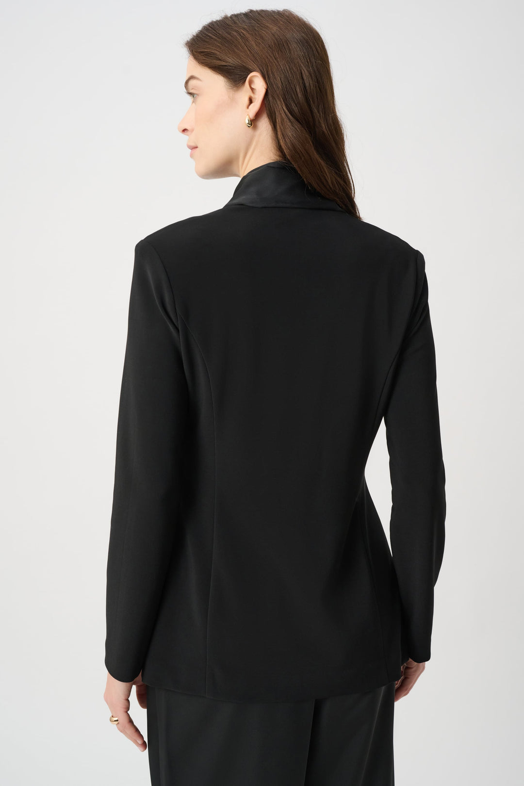 Black blazer jacket back view with long sleeves and smooth finish