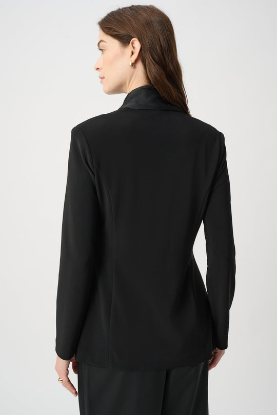 Black blazer jacket back view with long sleeves and smooth finish