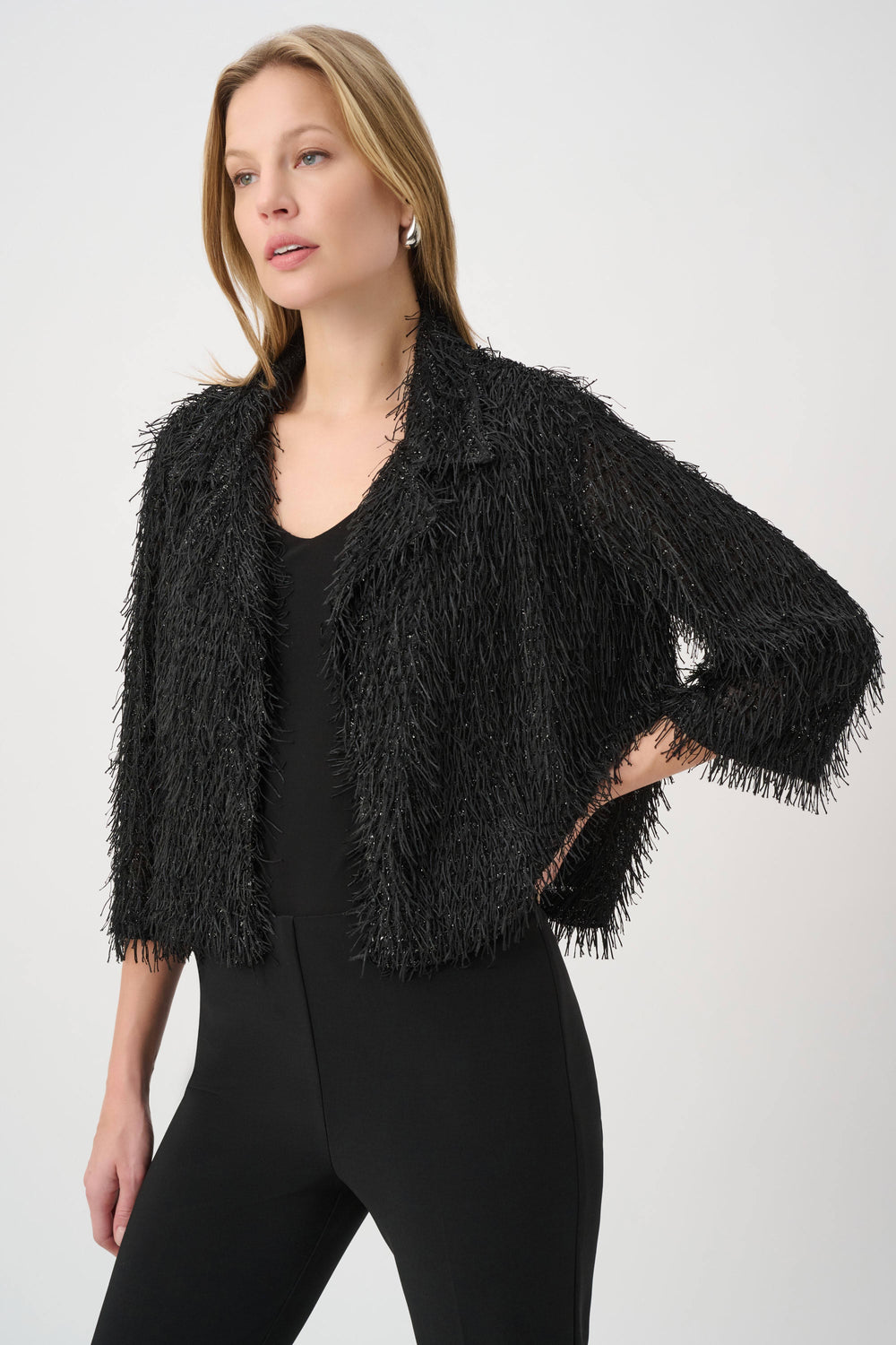 Black fringed short jacket with three-quarter sleeves, open V-neck front