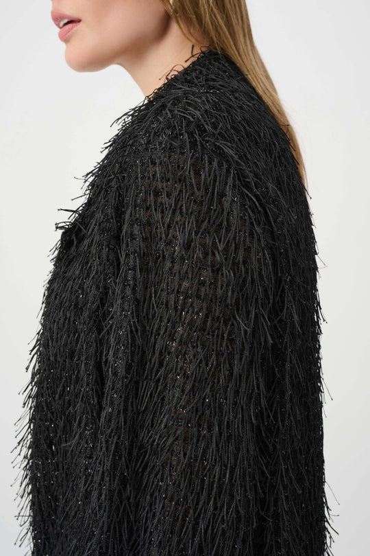 Black fringed short jacket shoulder detail with textured shag fringe
