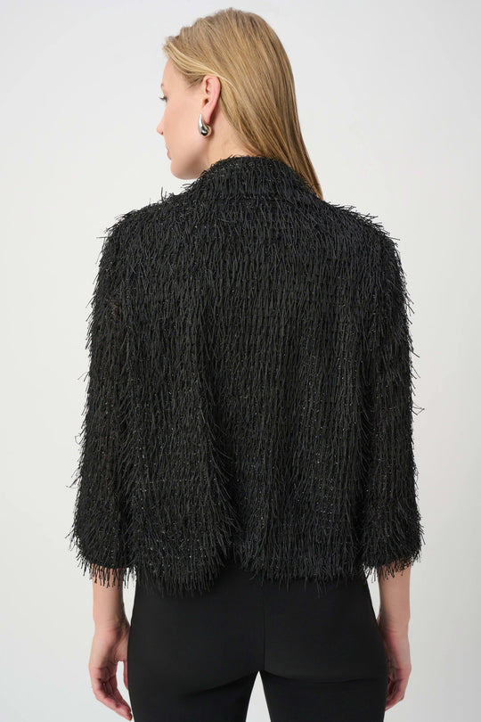Black fringed short jacket back view with textured shag fringe