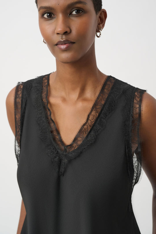 Black satin sleeveless tank with lace-trim V-neck and pleated front