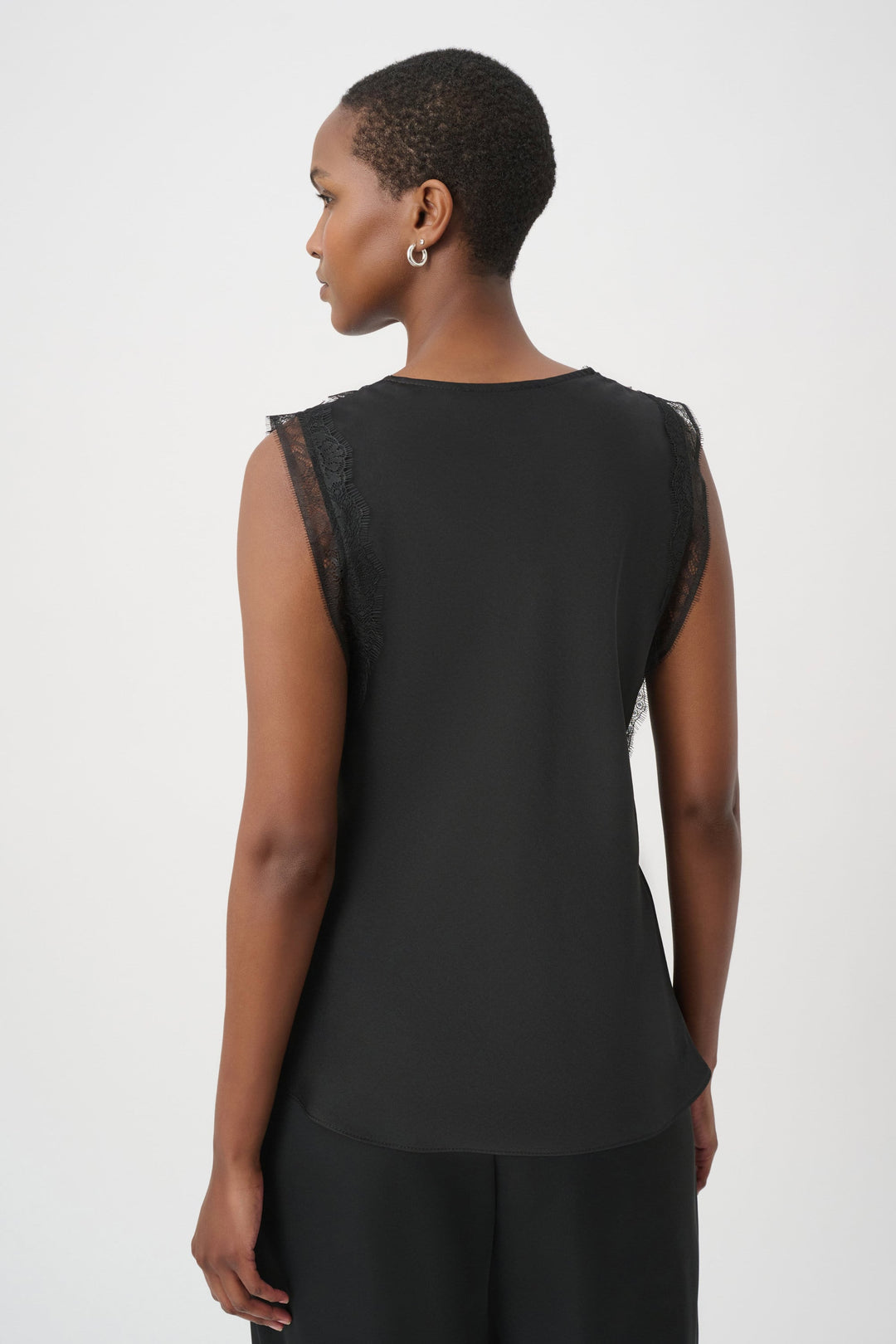 Black satin sleeveless tank with V-back and lace trim along shoulders