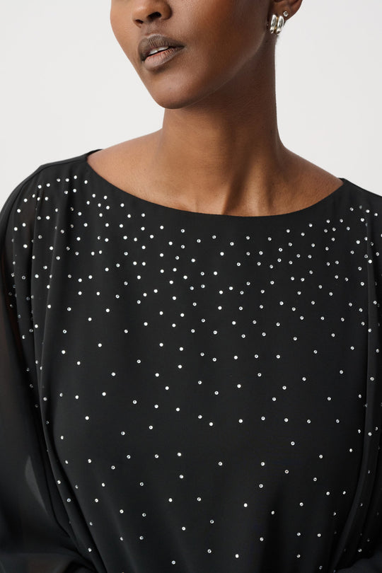 Black rhinestone-dotted poncho top with rounded neckline