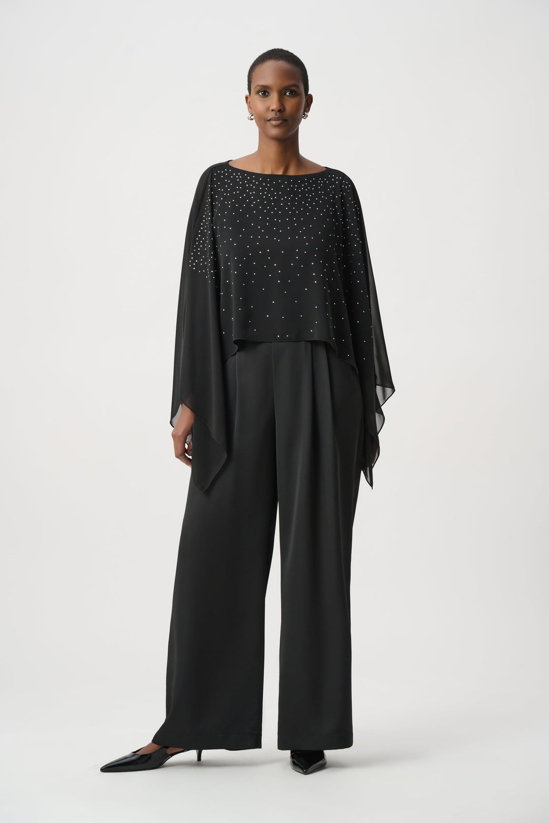 Black rhinestone poncho with layered tiers and cape-like draped sleeves