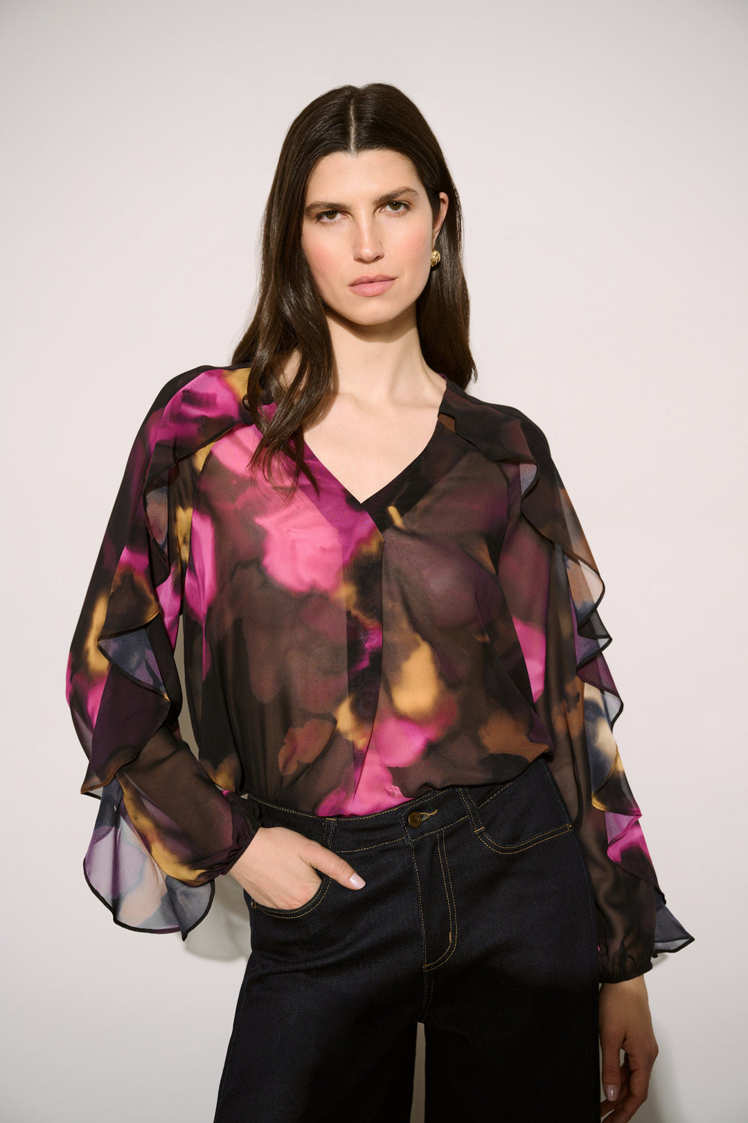 Joseph Ribkoff floral chiffon V-neck ruffle top in black and multicolor worn by model