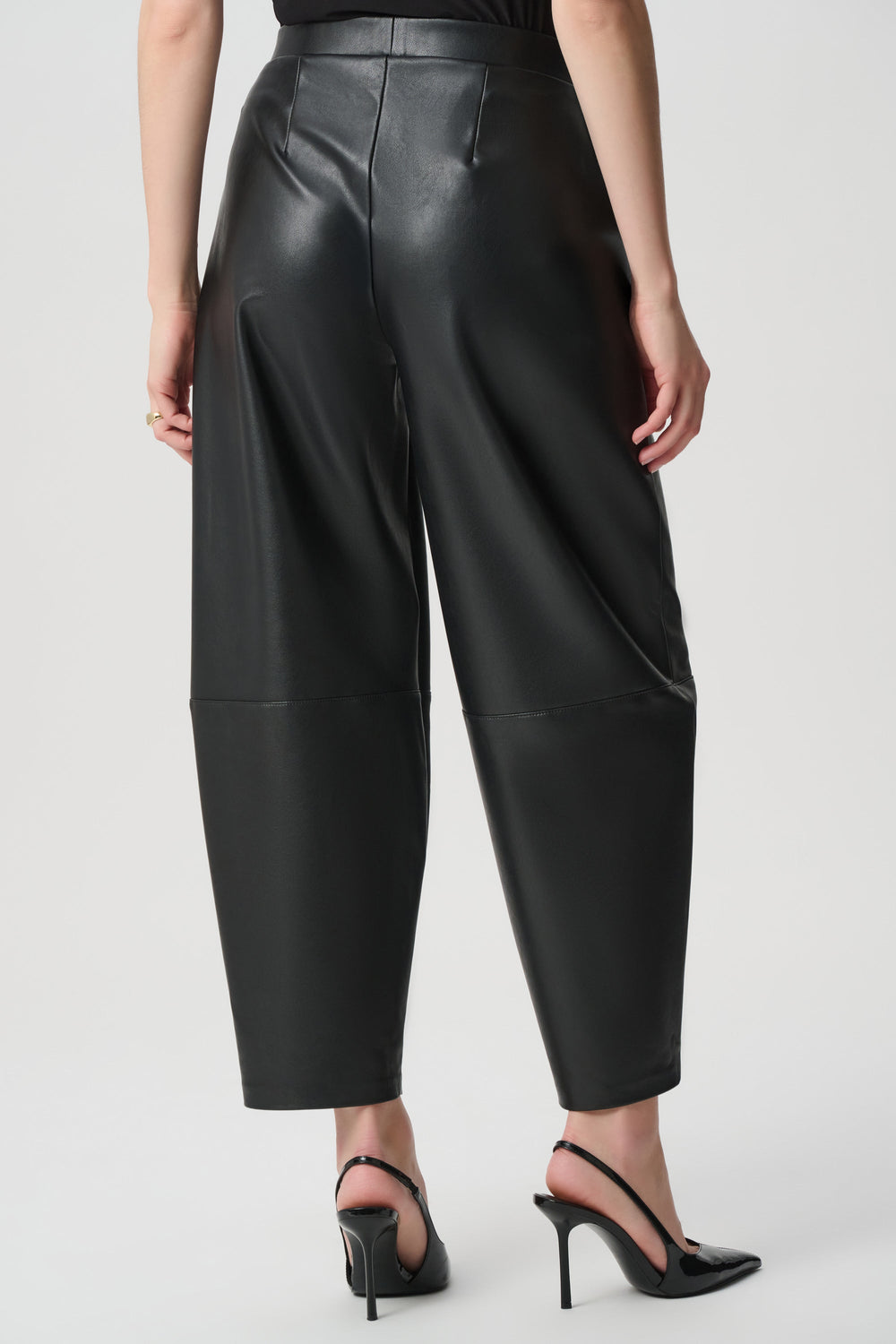 Joseph Ribkoff black leatherette barrel leg pants worn with black slingback heels, back view