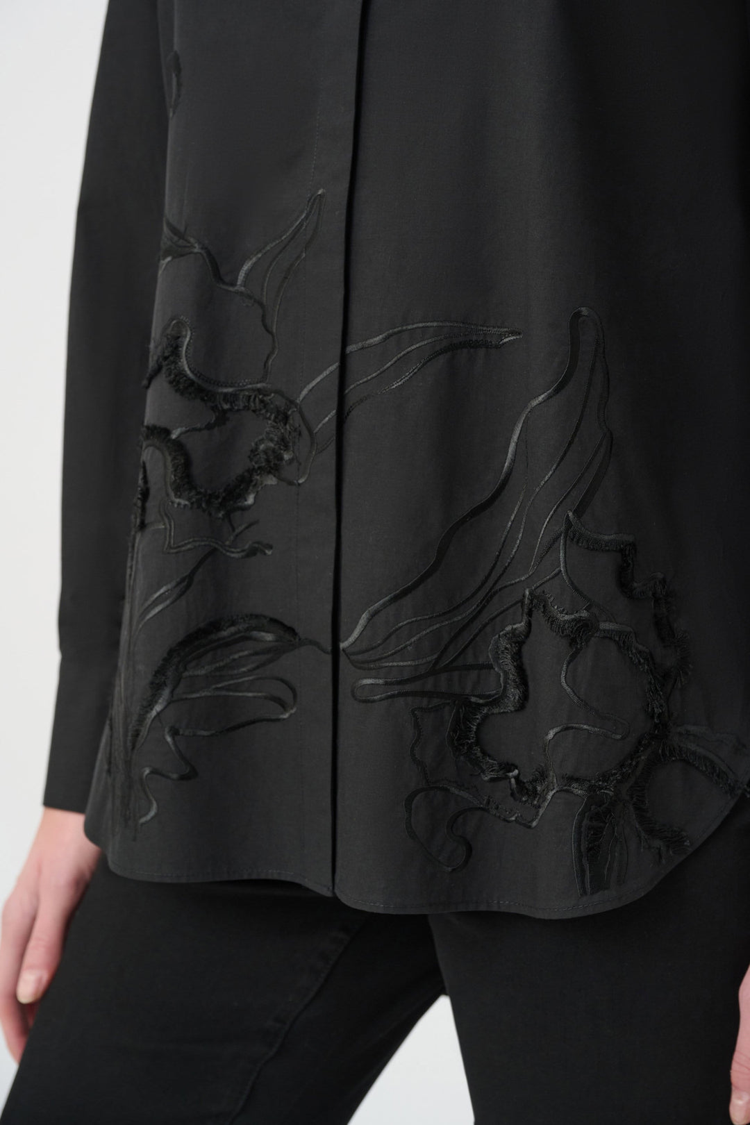 Black embroidered button-down shirt with floral detail along the front placket