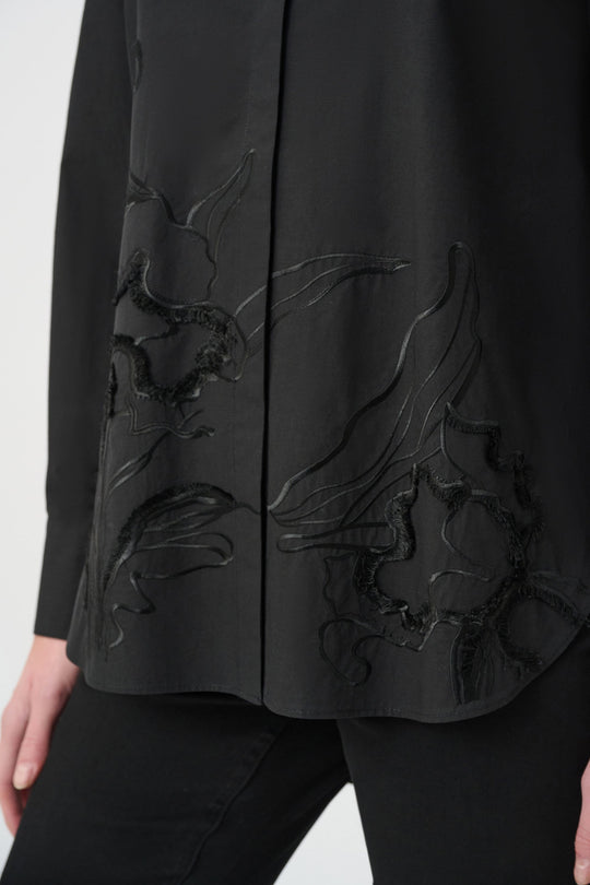 Black embroidered button-down shirt with floral detail along the front placket