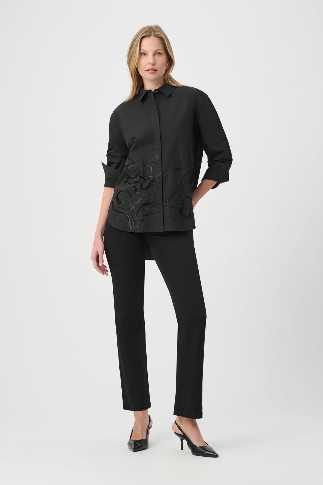 Black embroidered button-down shirt with long sleeves and button front