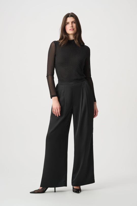Black fitted mesh long-sleeve top with high neck and rhinestone dot details
